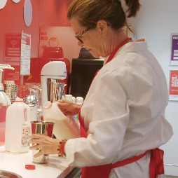 volunteer making a milkshake in a donor centre