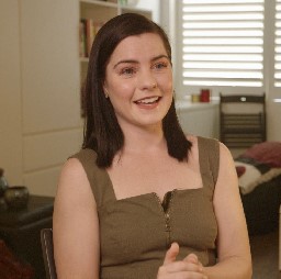 Actor chloe bayliss smiling looking past the camera