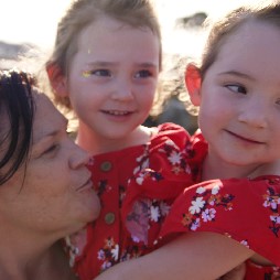 Michelle cuddling her twin girls