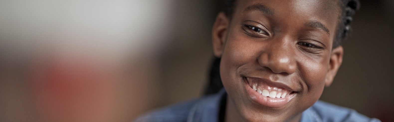 Bone marrow recipient Mapolo smiling off-camera, for Lifeblood