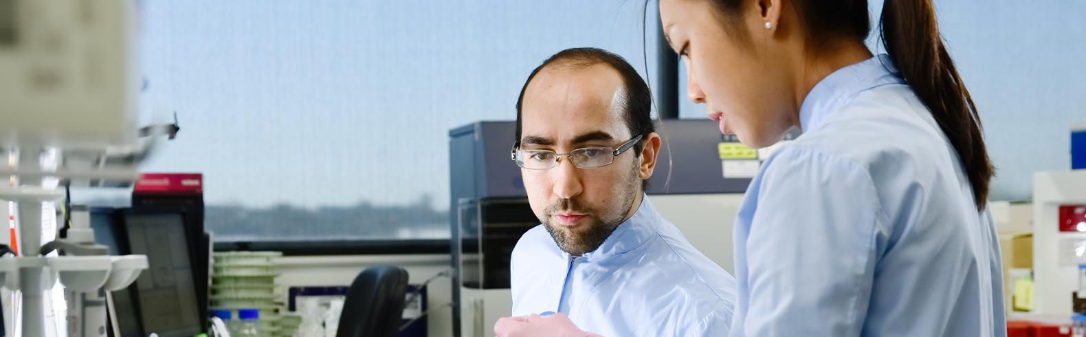 two scientists are working together in a lab