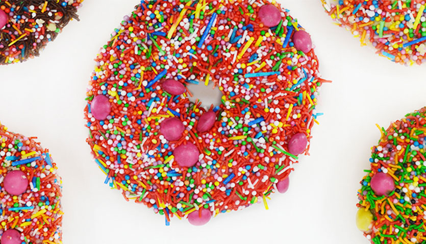 various colourful doughnuts with sprinkles