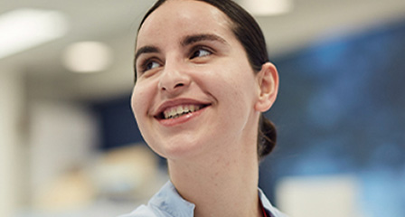a health professional smiling off camera