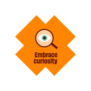 a magnifying glass with embrace curiosity written below