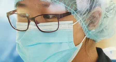 scientist wearing face mask and glasses
