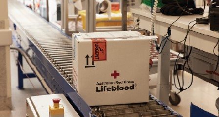 Lifeblood shipper on a conveyer belt