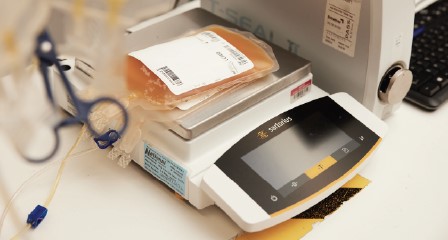 Bag of plasma laying on a set of scales