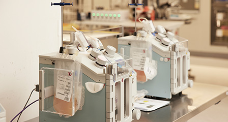 machine in laboratory with bag of blood components attached