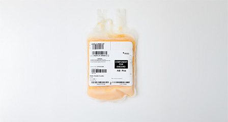 a bag containing orange plasma with a label on the front
