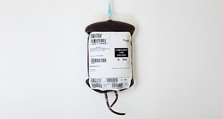 a bag containing red whole blood with a label on the front