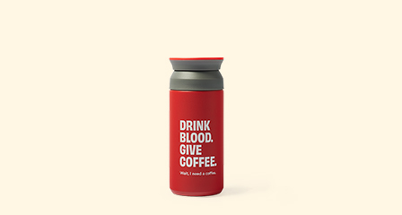 reusable coffee cup with drink blood give coffee written on it
