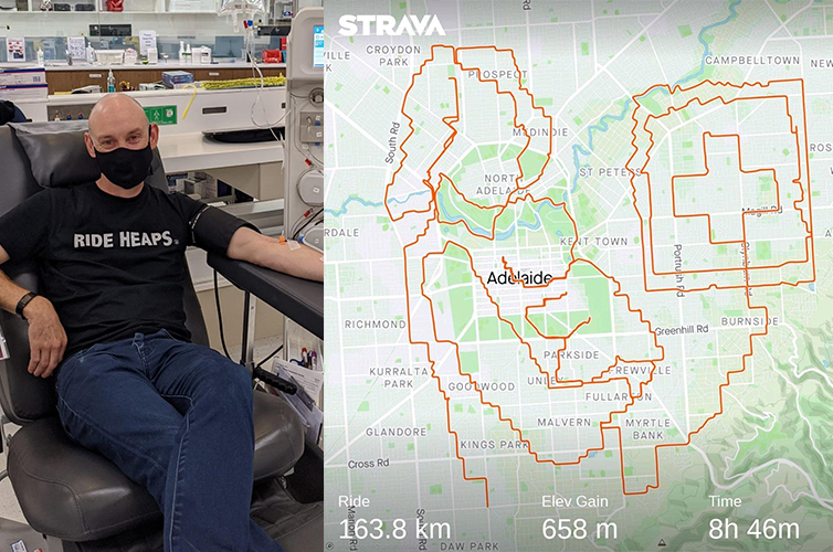 donor peter is sitting in a donation chair during a donation, he is wearing a t shirt with Ride Heaps written on it, on the right is a riding map of adelaide where he has drawn a picture of a woman holding a baby and the red cross logo with his bike path