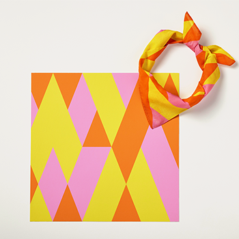 photo of Geoff Nees bandage design and bandana, it's a pattern with orange, yellow and pink geometric shapes