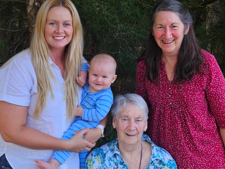 Image of three women and a baby boy smiling