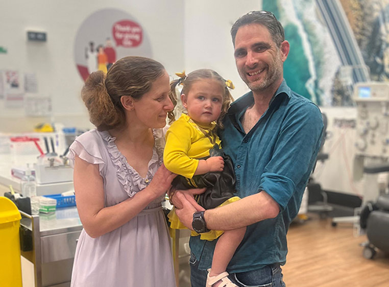 photo of a man and woman and their daughter in a donor centre