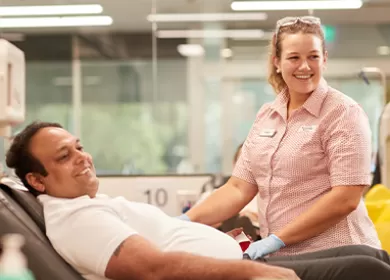 Nurse helping donor in a donor centre