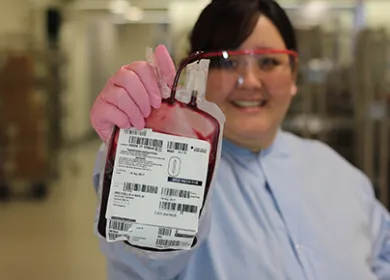 Woman holding bag of blood
