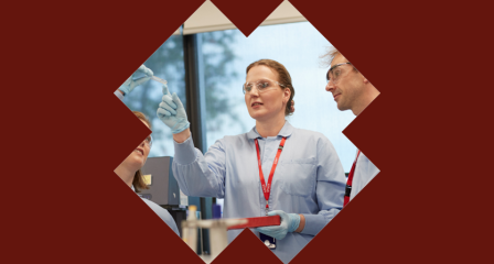 researcher looking at blood sample 