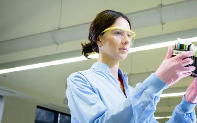 Female scientist processing blood