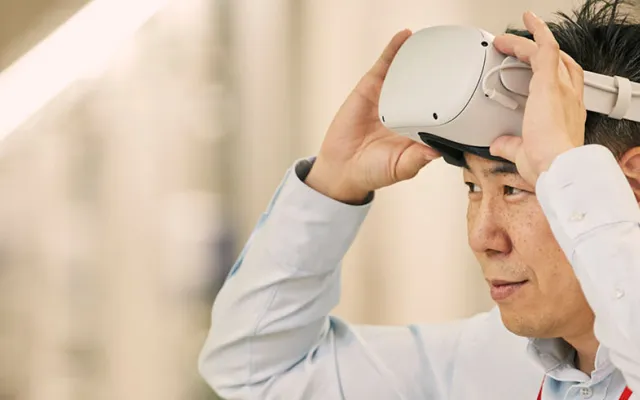 a person is removing a headset