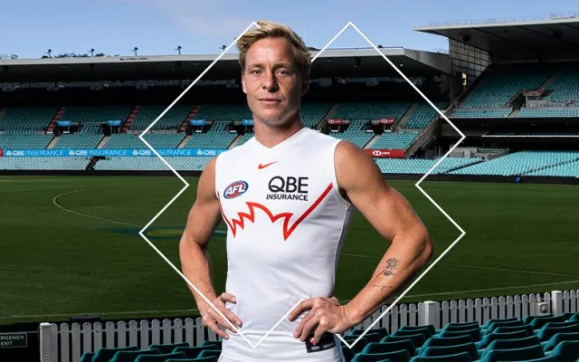 swans player isaac heeney wearing the gather round guernsey in the stands at the SCG