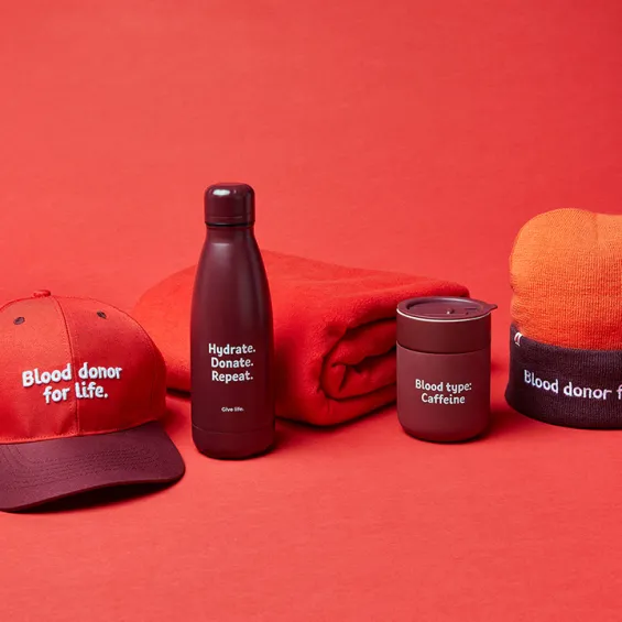 Lifeblood Gifts branded hat, drink bottle, towel, travel mug and beanie