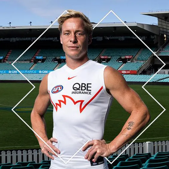 swans player isaac heeney wearing the gather round guernsey in the stands at the SCG