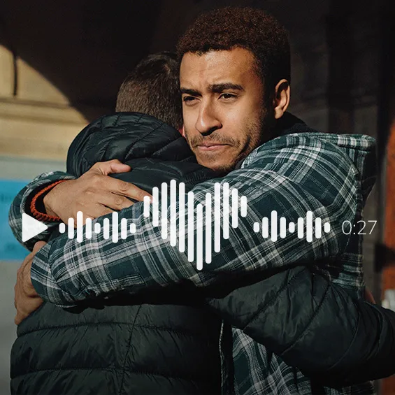 Two men hugging with an icon of an audio wave ontop