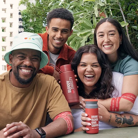 four people with the gifts products smiling
