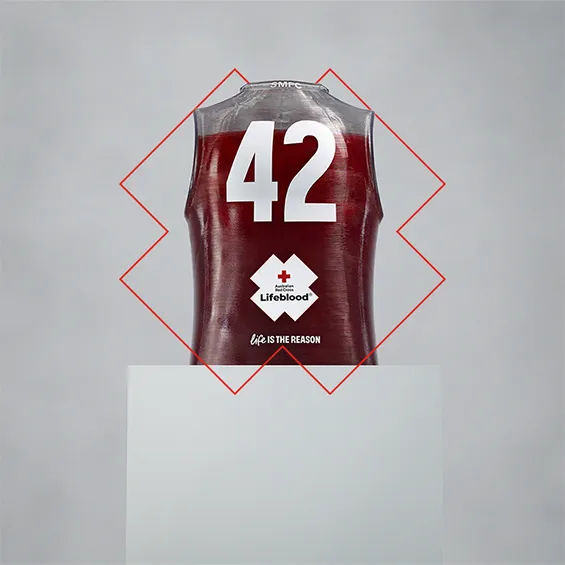 sculpture of a football guernsey almost filled with red with the number 42 and lifeblood logo