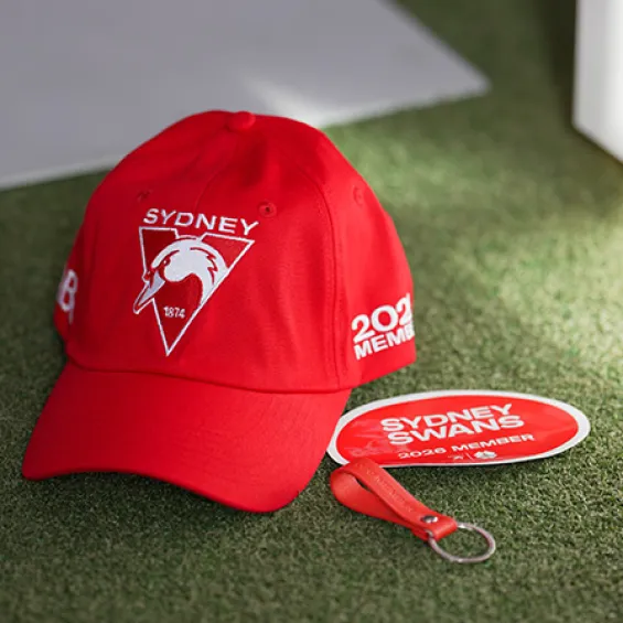 a red sydney swans cap and keyring