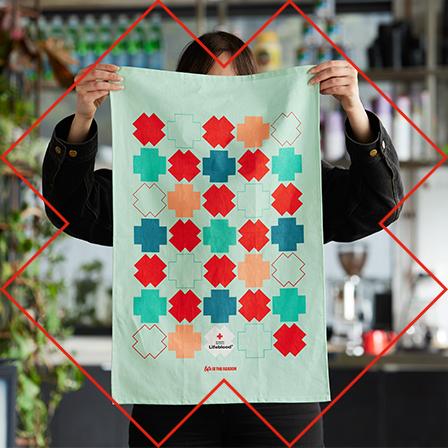 a tea towel with red, green and blue colours