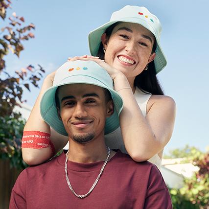 two people wearing lifeblood bucket hats