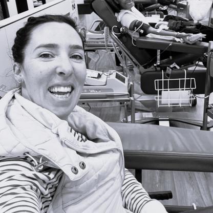 A woman taking a selfie while on a couch in a donor centre