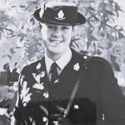 A female service officer wearing her uniform
