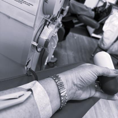 An arm with a needle during a donation