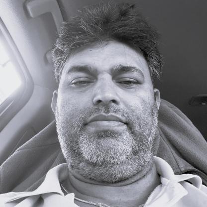 A man taking a selfie in the car