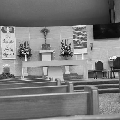 alter and pews in a church during a service