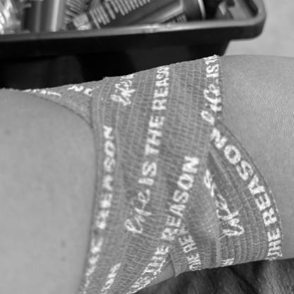 close up of a post donation bandage with Life is the reason printed on it