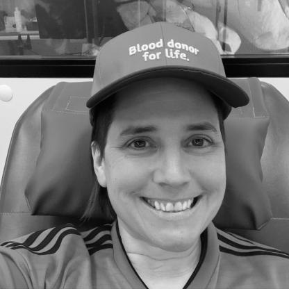 A woman in the donor chair smiling 