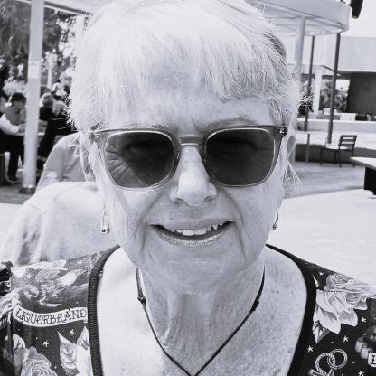 A woman with sunglasses smiling