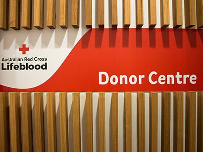 front view of a sign on a wall with the Lifeblood logo on the left and donor centre is written on the right