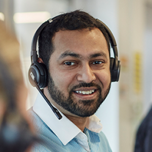 Man wearing a headset in a call centre