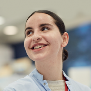 Young scientist looking off-camera, smiling