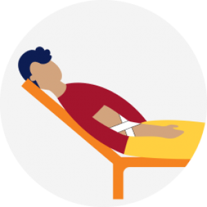 Person lying in chair with a bandage
