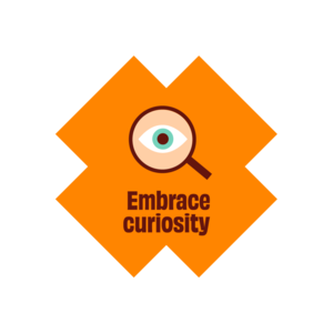 a magnifying glass with embrace curiosity written below