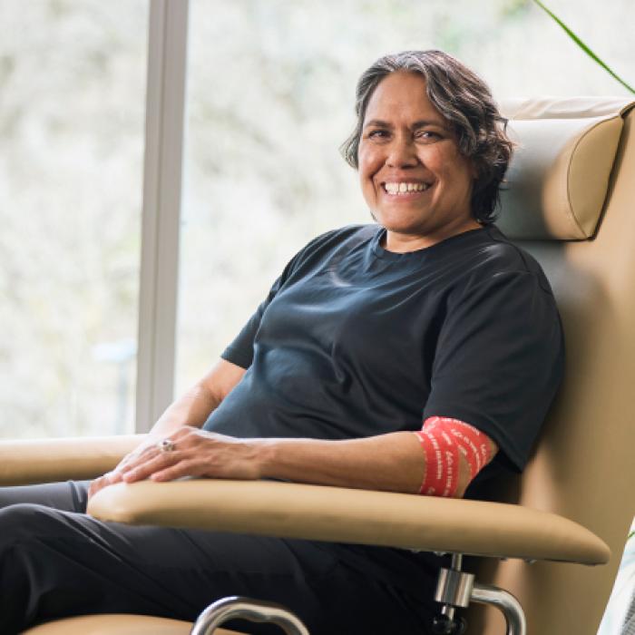 photo of cathy freeman in a donor chair smiling to camera